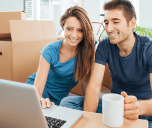 5 Secrets to an Easy Move to a New City Couple on Laptop image