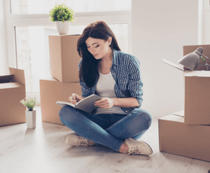 5 Secrets to an Easy Move to a New City Woman with Boxes image