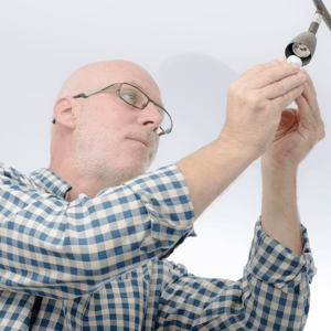 ways-to-winterize-your-home-man-replacing-lightbulbs-image.png