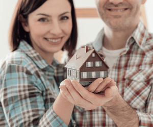 7 Valuable First Time Home Buyer Resources Couple Holding House Image